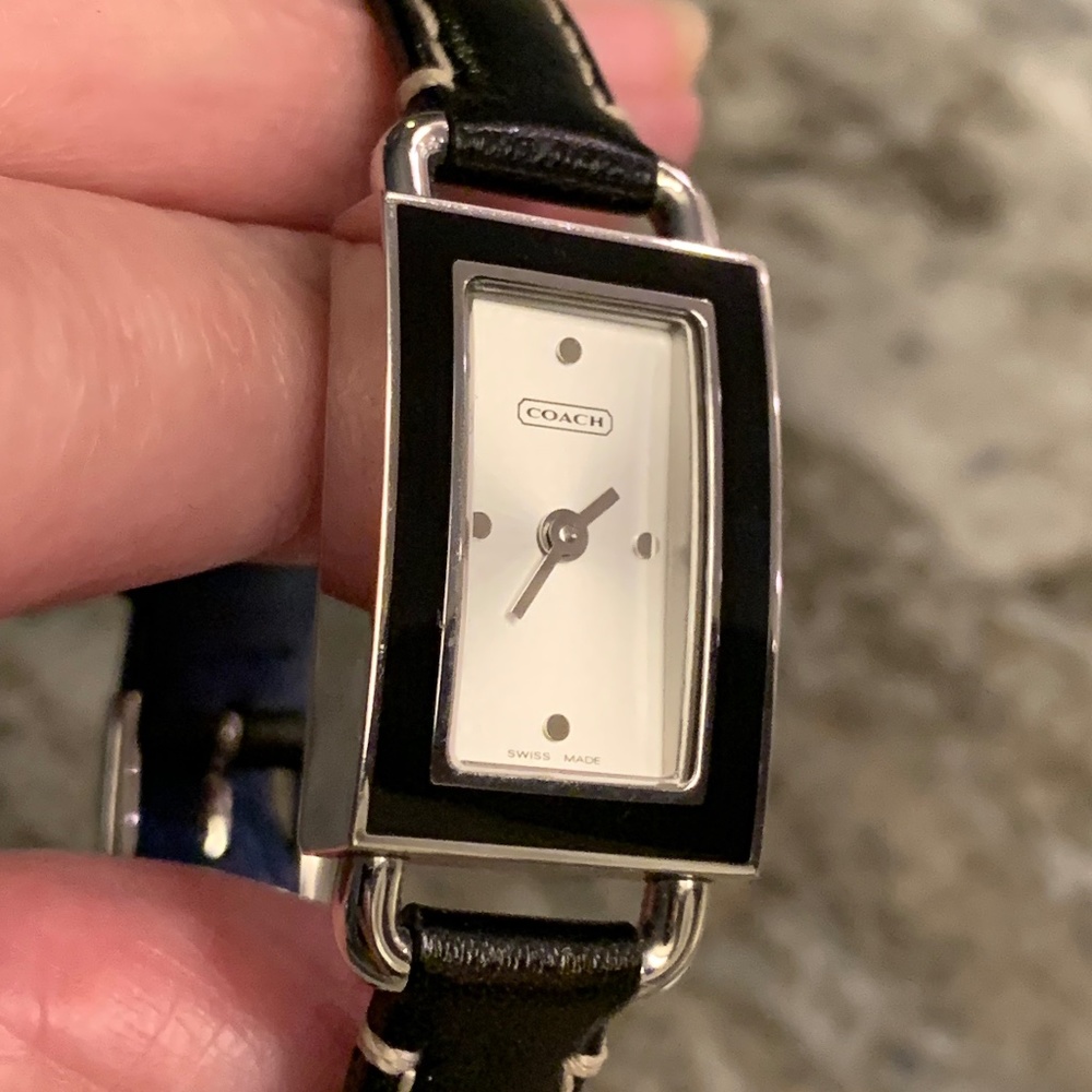 Sleek Coach Watch with slim rectangle face framed in shiny black enamel. UEC